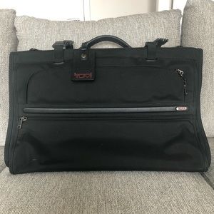 Tumi tri-fold carry on travel friendly garnet bag